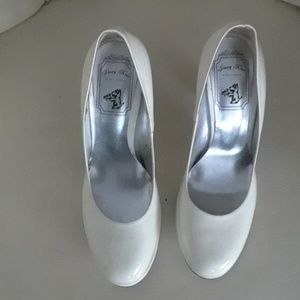 White patent leather pumps